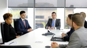 minc law team in the boardroom talking