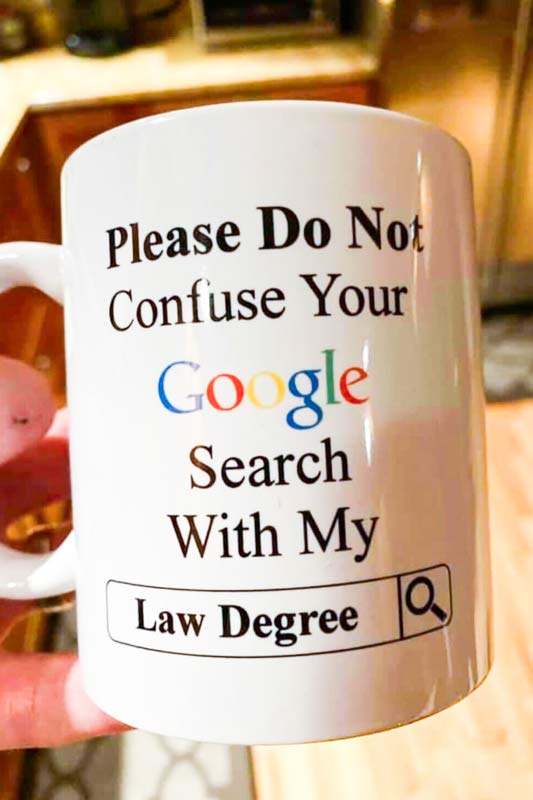 Dan's mug: "Please do not confuse your Google search with my law degree"